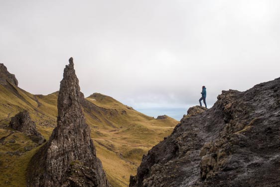 Person Standing on Cliff